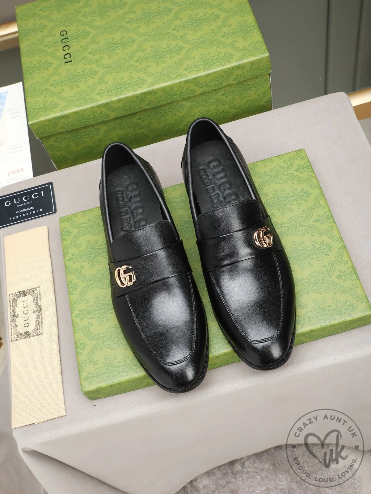 Black Leather Gucci Loafers with Gold GG Logo for Men